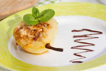 Pear baked with honey, curd cheese, walnuts