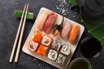 Set of sushi and maki roll and green tea