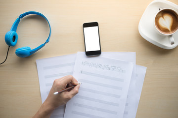 composing music note  top view with hand writing coffee and blue