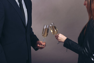 man and woman celebrating with Champagne, toast, party time