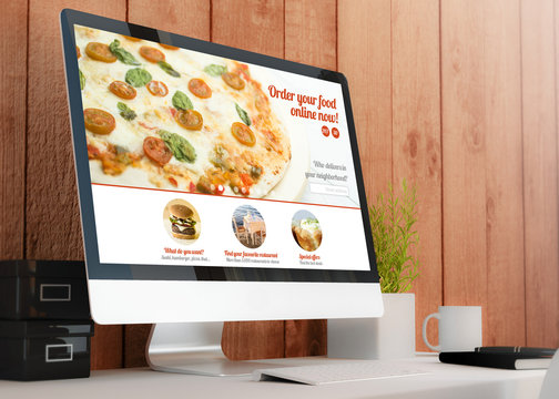 modern workspace with computer showing order food online website