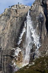 Fototapeta na wymiar Rainbow in Waterfall Yosemite Falls