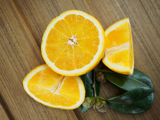Fototapeta na wymiar Fresh orange on a wooden table