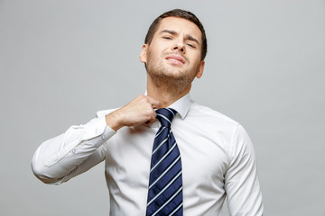 Handsome stylish businessman on grey background