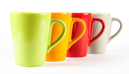 Four color tea cups shown in row