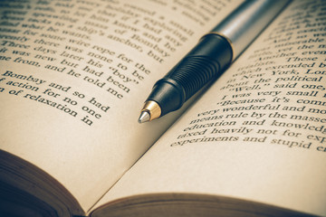 pen and book with filter effect retro vintage style