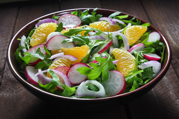 Salad with arugula, radish,red onion and tangerine