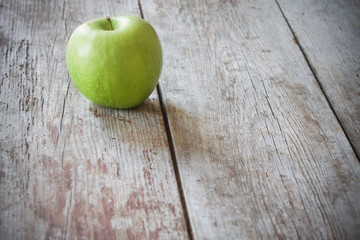 green apple on wooden background