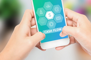 Hand holding the phone label CASH FLOW message, Can be used in advertising