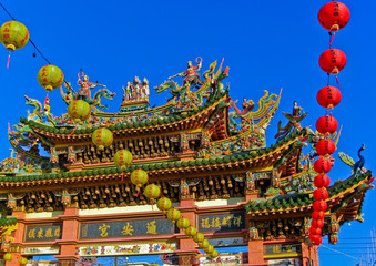 Gate of a Chinese temple decorated with colorful paintings and sculptures in Kaohsiung, Taiwan