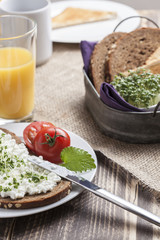 healthy spring summer low fat breakfast with orange juice,coffee,bread,cottage cheese, cress and tomatos