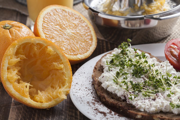 healthy spring summer low fat breakfast with orange juice,coffee,bread,cottage cheese, cress and tomatos
