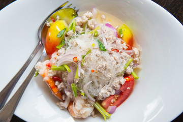 Thai spicy glass noodle salad with seafood on the plate