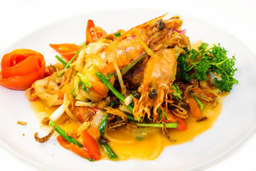 Fried king prawns served with vegetables.