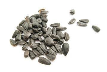 some sunflower seeds on white