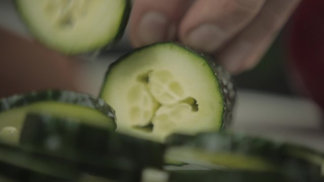 Cut Thin Slices of Cucumber in Restaurant