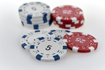 Casino chips on a white table