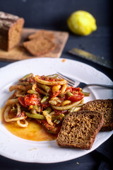 Stewed squid rings with tomato sauce and chilli