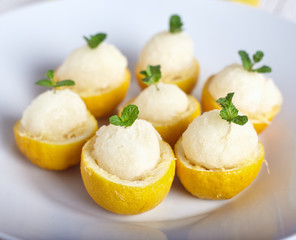 Lemon sorbet or ice cream inside fresh lemons