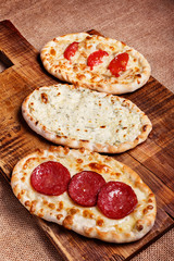 Turkish pita bread with cottage cheese, chicken, salami and toma