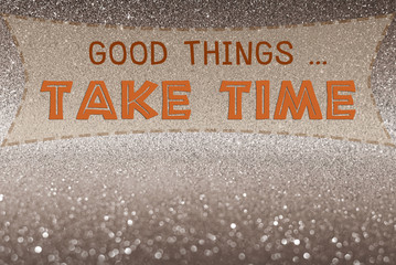 Good things take time word on glitter abstract background