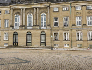 Fototapeta na wymiar COPENHAGEN, DENMARK -SEPTEMBER 8: Castle Amalienborg with statue