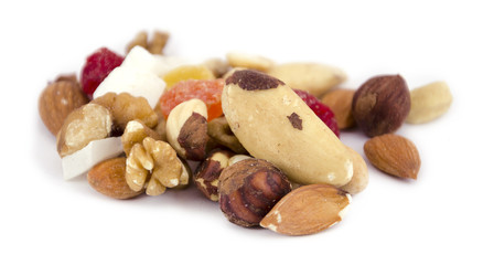 Mix of nuts and dried fruits on a white background 