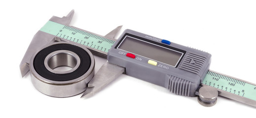 Bearing and electronic caliper on a white background