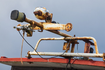 Abandoned and wrecked old fishing boat at the mouth of River Wansbeck, on the coast of Northumberland, England, UK.