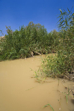 Bethany beyond the Jordan - cloudy water of the Jordan River