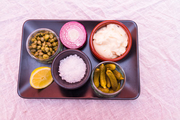 Obraz na płótnie Canvas Tartar sauce separate ingredients, mayonnaise, salt, gherkins, c