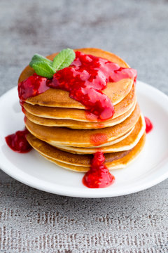 Stack of pancakes with fresh berry.