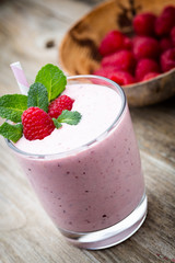 Raspberry milk shake with mint decor.