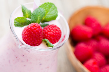 Raspberry milk shake with mint decor.