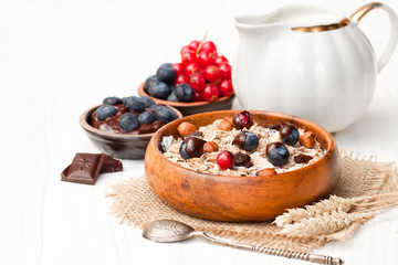 Healthy  breakfast with muesli and chocolate covered berries