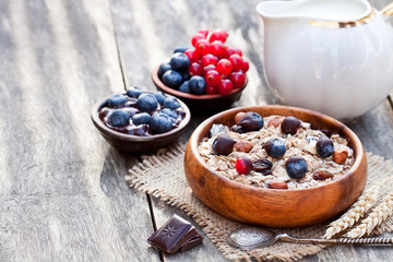Healthy  breakfast with muesli and chocolate covered berries
