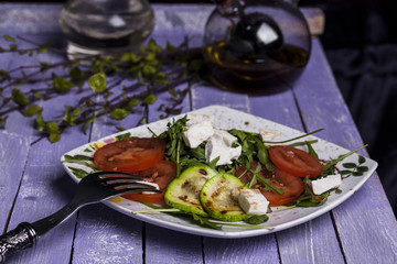 Zucchini salad with tomatoes and cheese