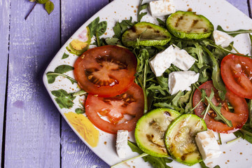 Zucchini salad with tomatoes and cheese