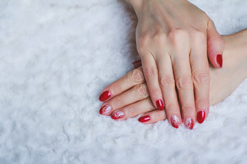 Red nail art with white lace with dots and lines