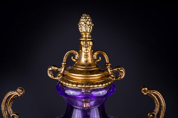 Fototapeta na wymiar Ancient vase of glass purple