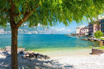 beautiful beach on Garda Lake, Italy - obrazy, fototapety, plakaty
