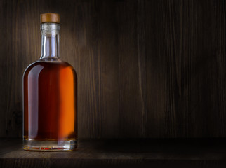 Bottle of whiskey on a wooden