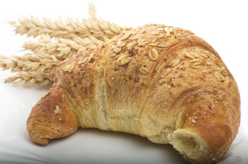 croissants to cereals on a white plate
