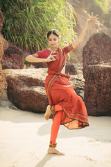 Beautiful indian woman dancer in traditional clothing © gilitukha
