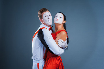 Fototapeta premium two funny mimes isolated on gray background