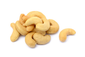 Tasty salted cashew nuts on a white background