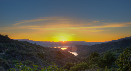 Panoramic view of sun just about to peek out over Lake Casitas.