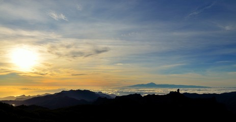 Sunset from the Canary islands with Roque Nublo and Tenerife island in background