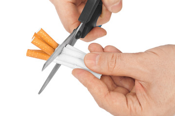 Hand with scissors and cigarettes