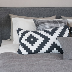 black and white pillows on modern bed
